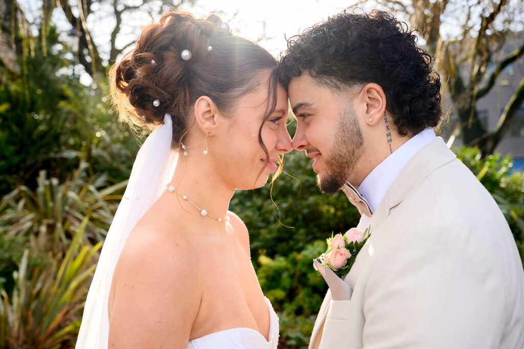 Bride and groom looking at each other during a golden hour photo session.